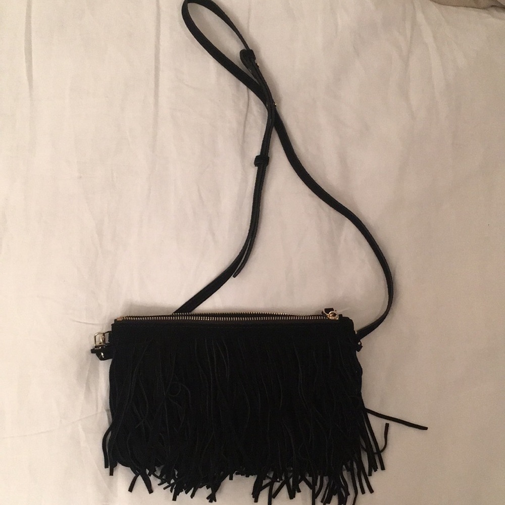 Fringe purse with charger inside.